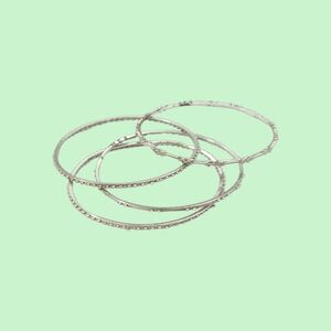 Beautiful Thin Bangles Silver Tone Metal Bracelets with Design Accents. 4 Pieces